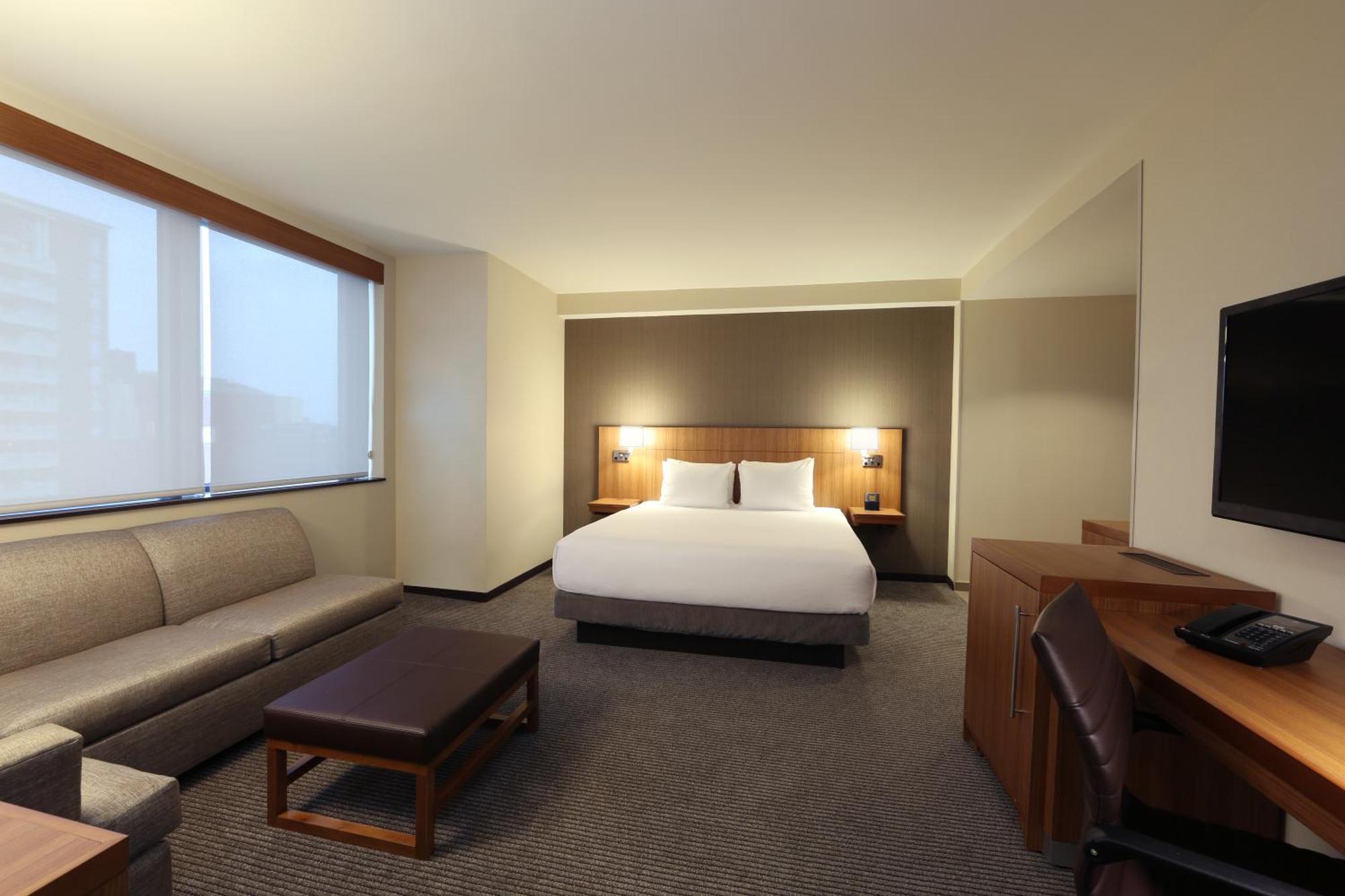 One-Bedroom King Suite Roll Shower Disability Access