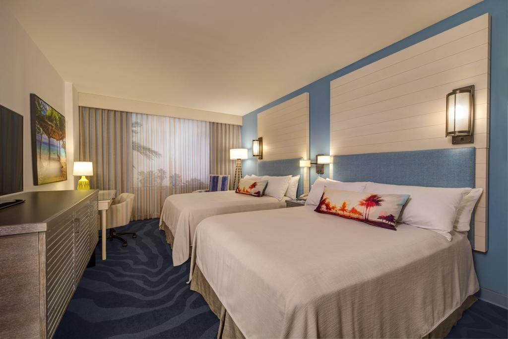 Mobility or Hearing Accessible Pool View 2 Queen Room w or ADA tub Includes Early Park Admission*